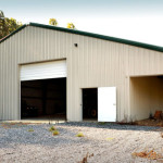 Steel building shop with implement covered storage